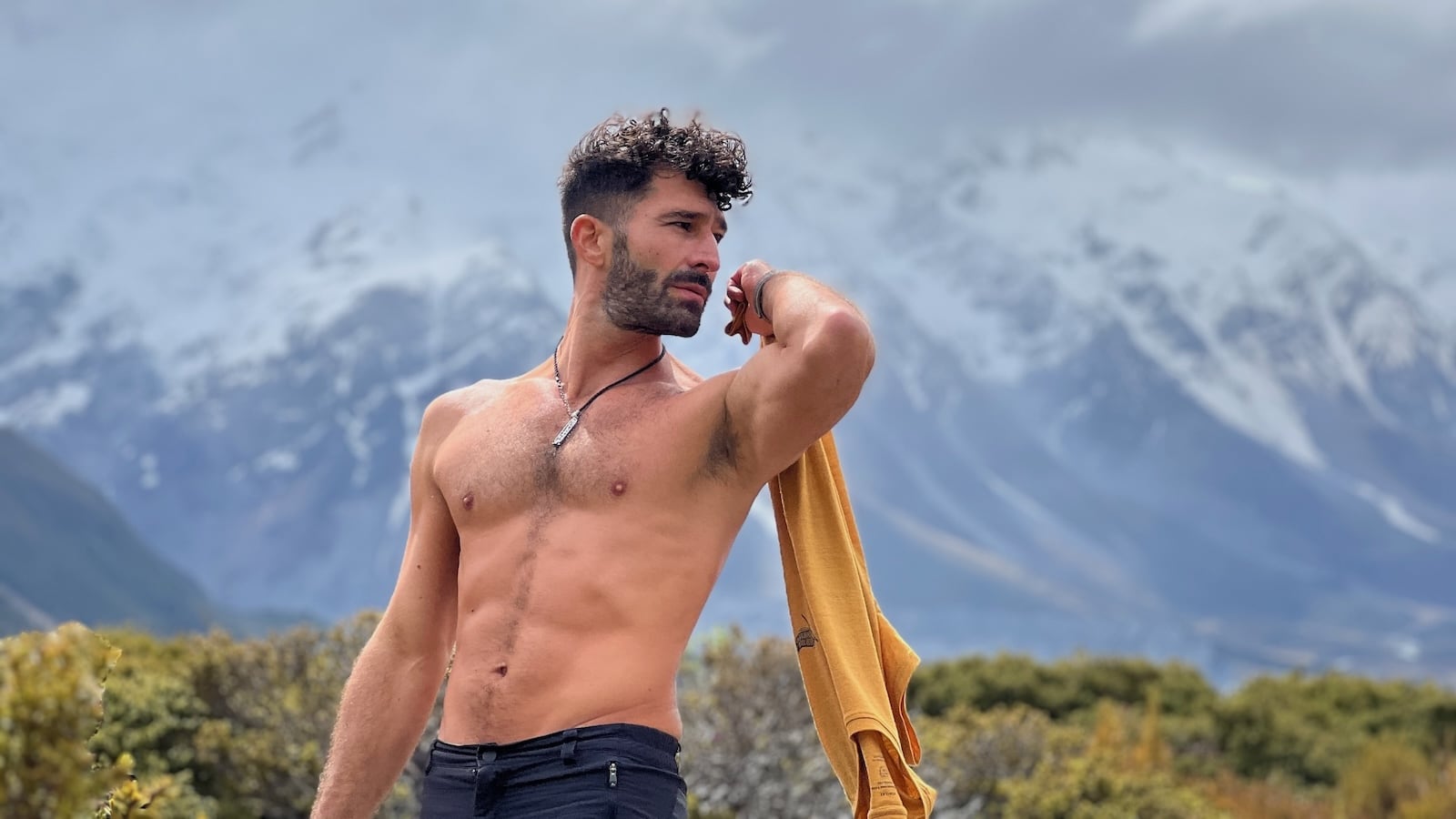 Stefan shirtless in Mount Cook celebrating gay Pride in New Zealand.