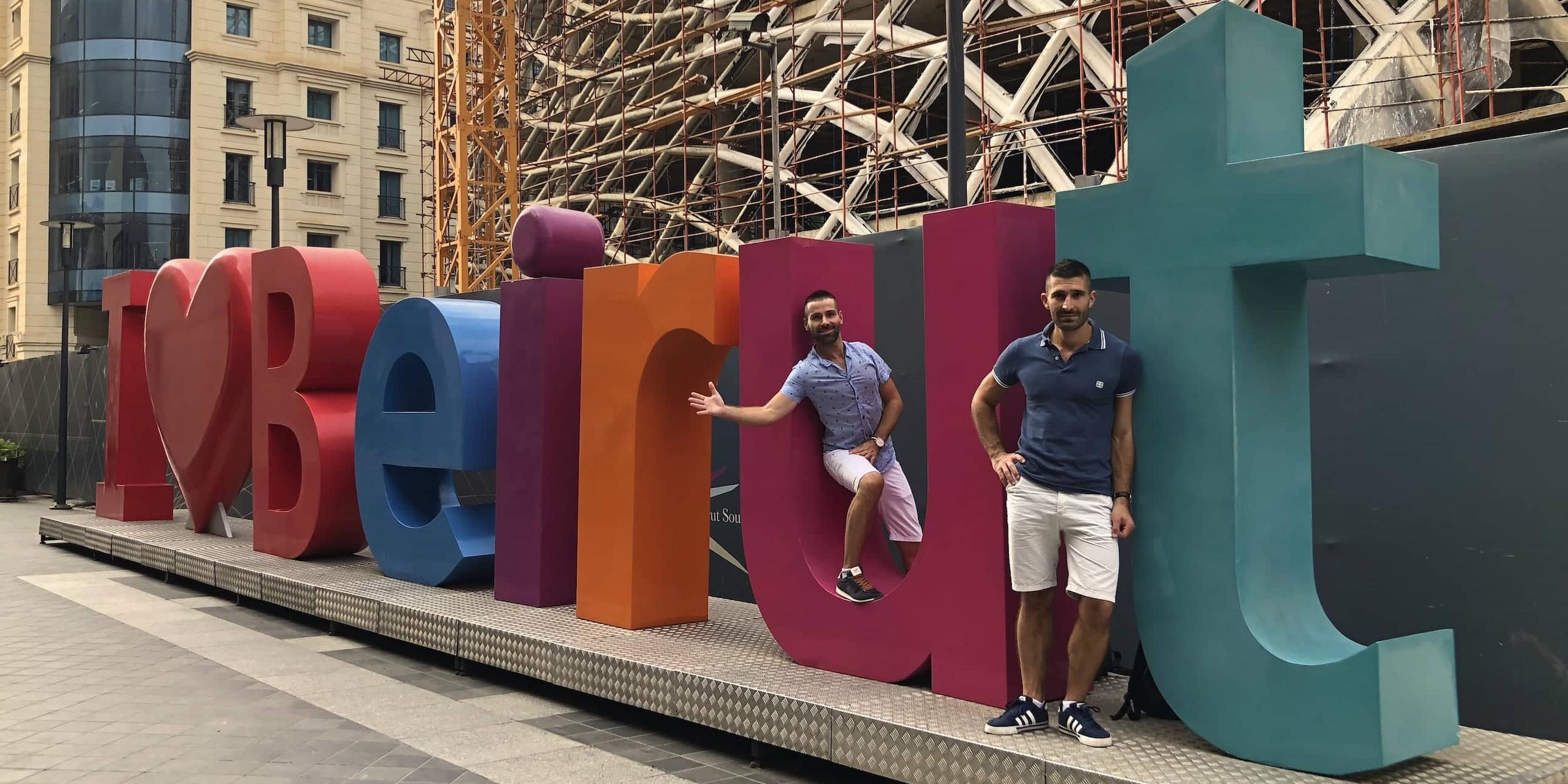 Gay couple by the I Love Beirut sign in downtown Beirut.